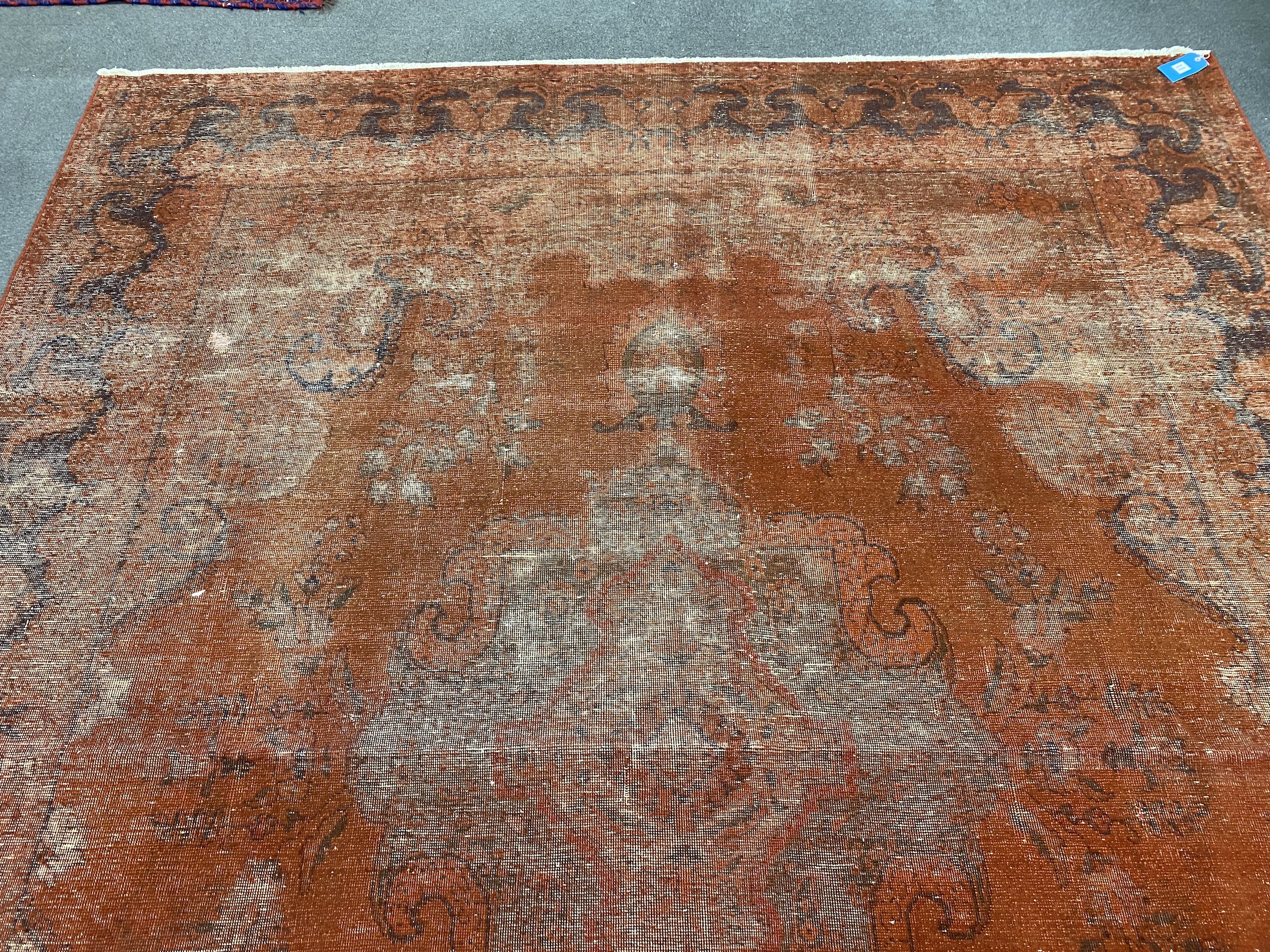 A red ground carpet, 360 x 298cm